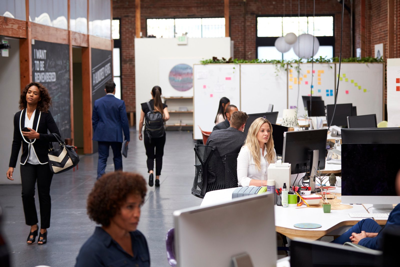 business team working at desks in modern open plan 2024 10 19 11 08 51 utc scaled